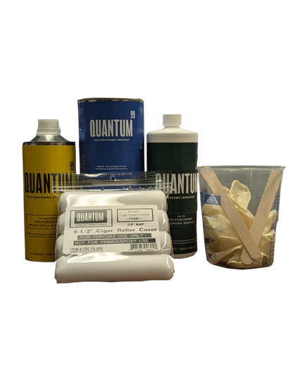 Displayed is the all the items that come with a 28 foot brush kit from left to right 1 qt brushing activator, 1 pack of mohair foam rollers, 2 qts of Quantum 99 Base Coat, 1 qt solvent brushing reducer, 1 32 oz measuring cup, 2 stirs sticks and 1 pair of gloves inside the measuring the cup. 